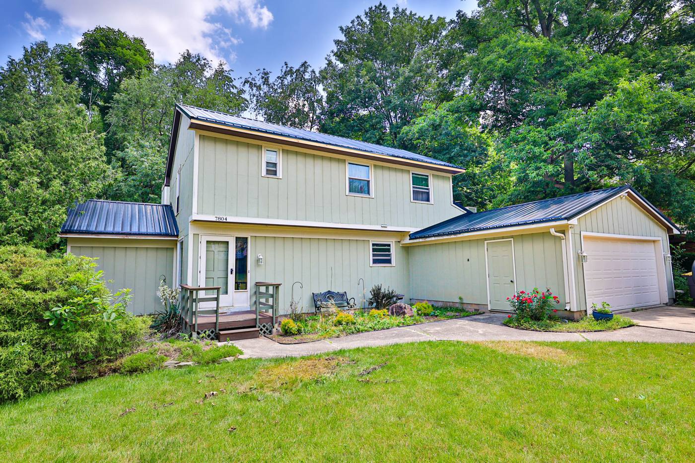 Two-story home with attached garage purchased by Middle America Homes